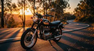 2025 Kawasaki W230 retro motorcycle on a scenic road at sunset