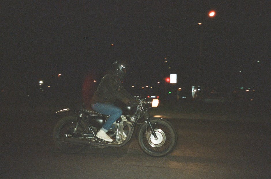 Motorcycle Vibration Issues: Causes & Fixes 5 Illustration of a person riding a motorcycle with vibrant lines indicating vibration impact